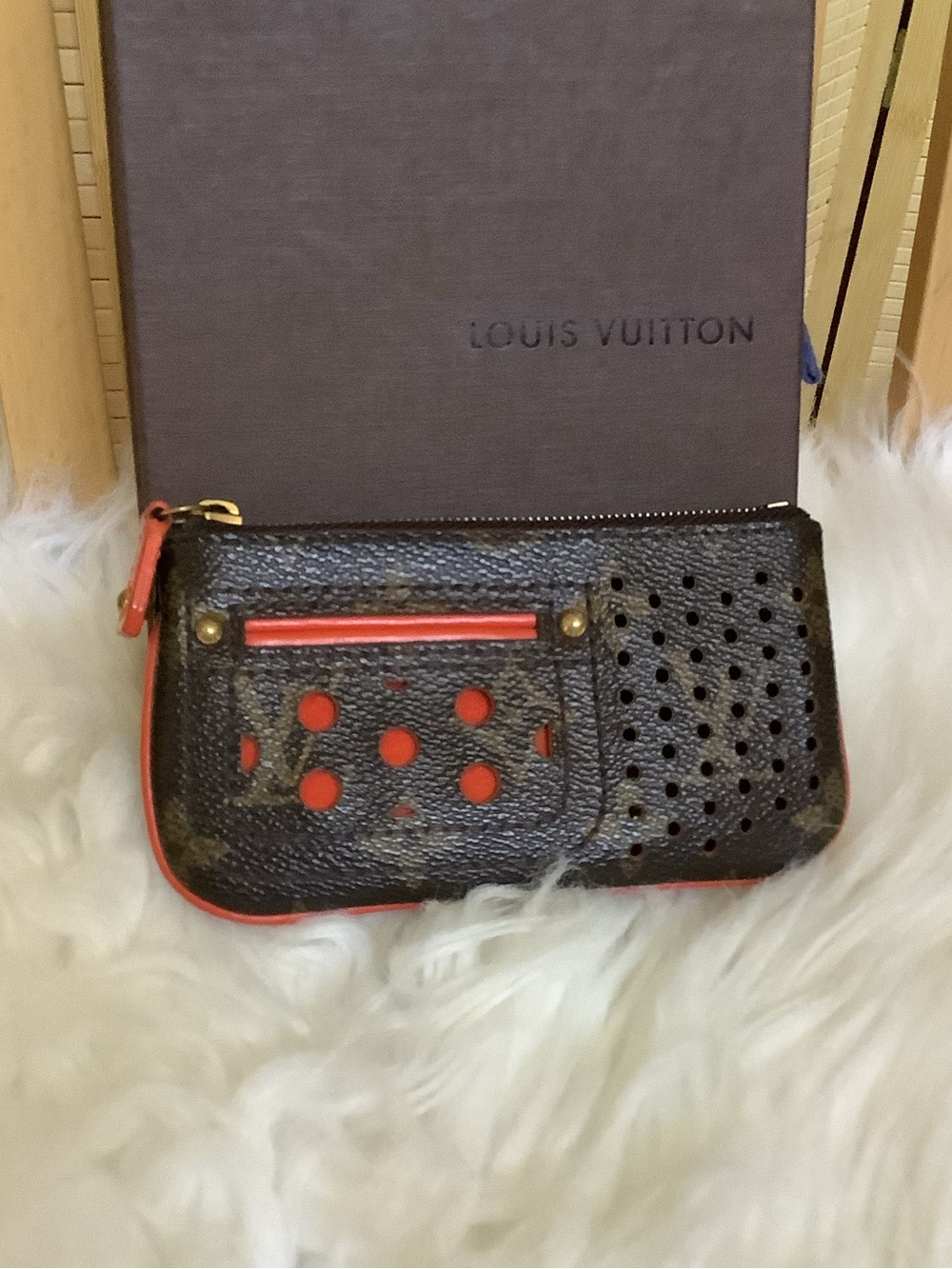 LOUIS VUITTON
Monogram Perforated Key Pouch Orange